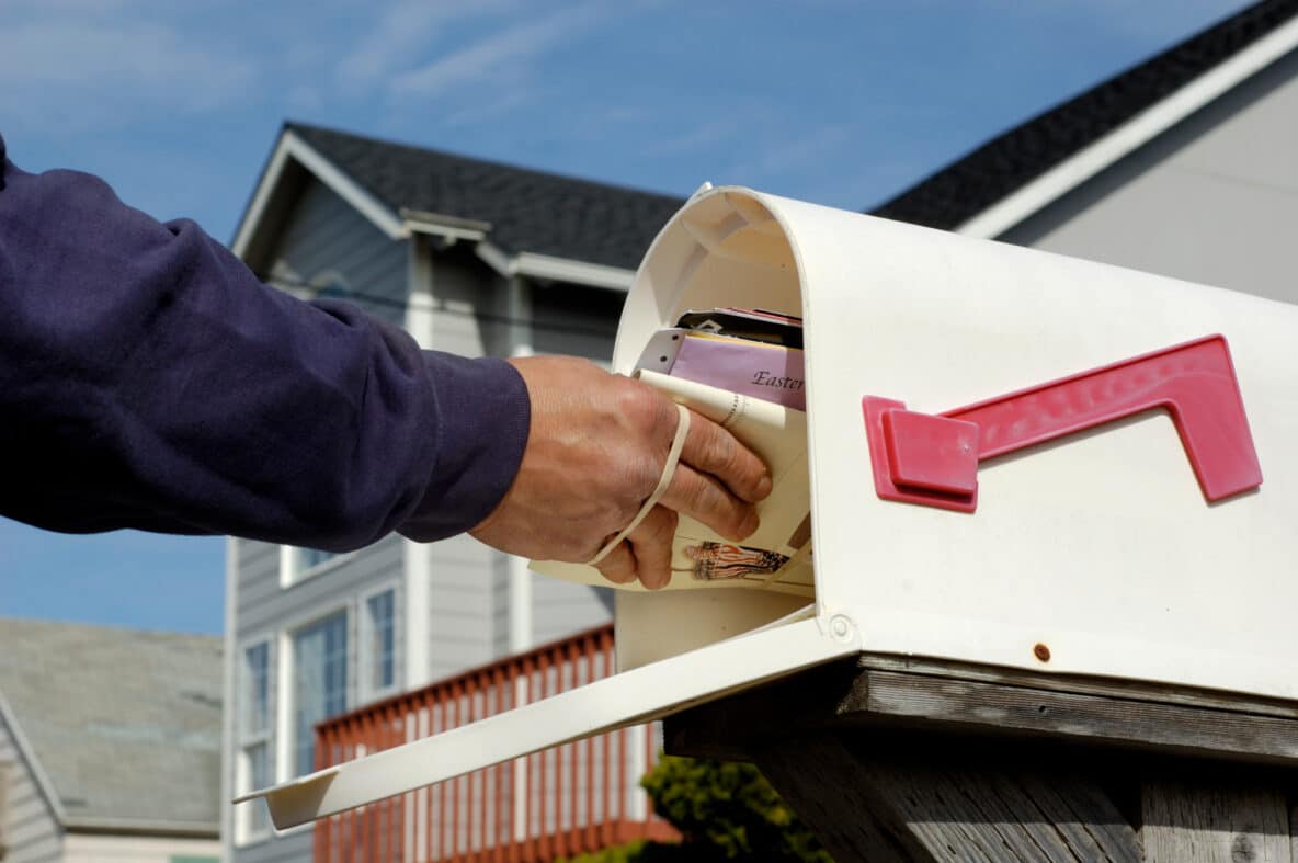 Mail being put in mailbox